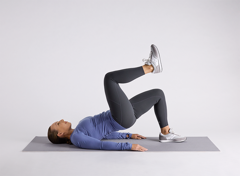 woman-doing-single-leg-bridge-on-yoga-mat