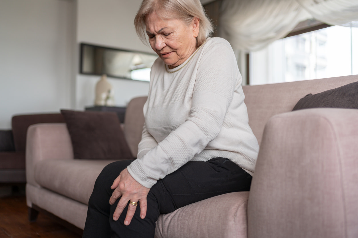woman feeling osteoarthritis flare up
