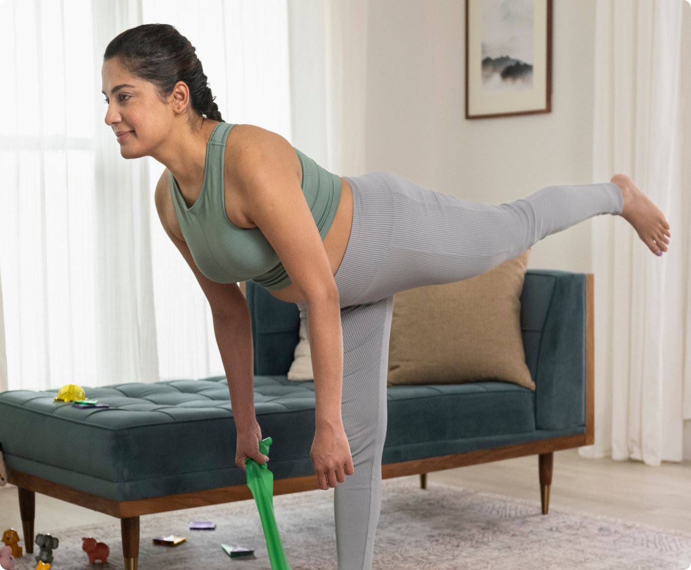 Woman in a yoga pose, stretching with left leg fully extended