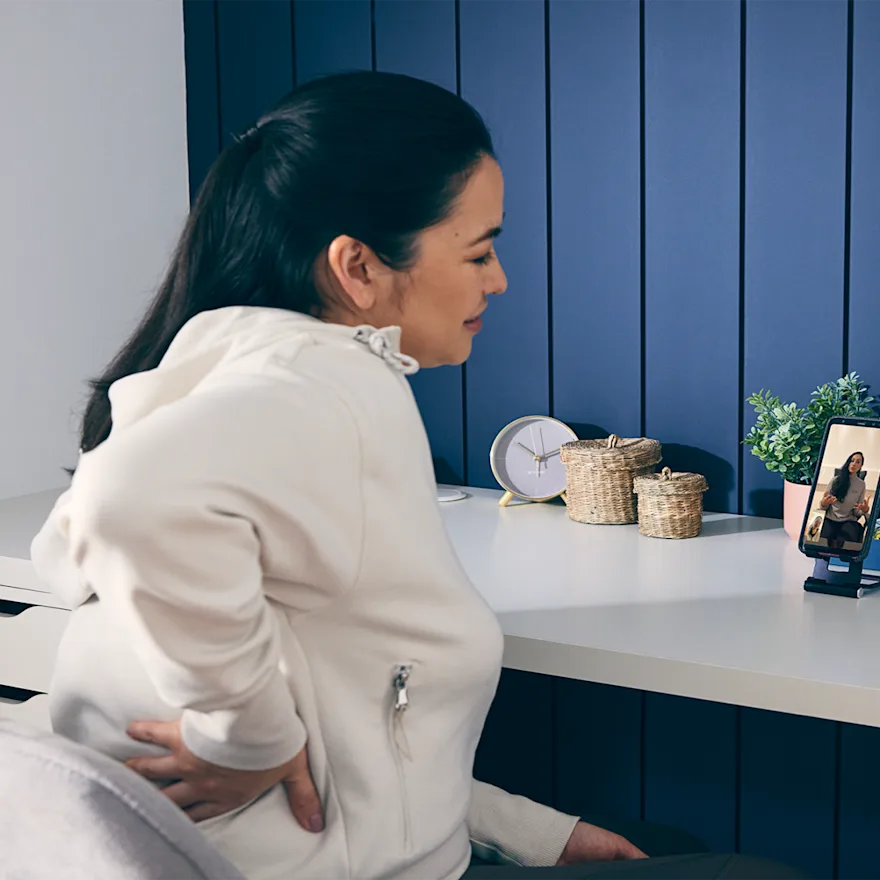 Person at desk with back pain