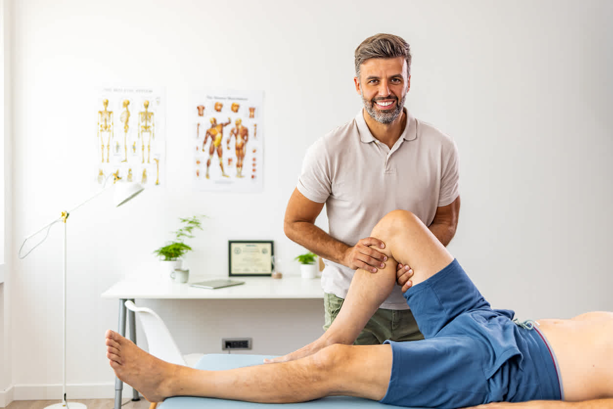 physical-therapist-stretching-a-pacient-knee