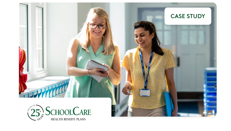 Two teachers walking down a hallway