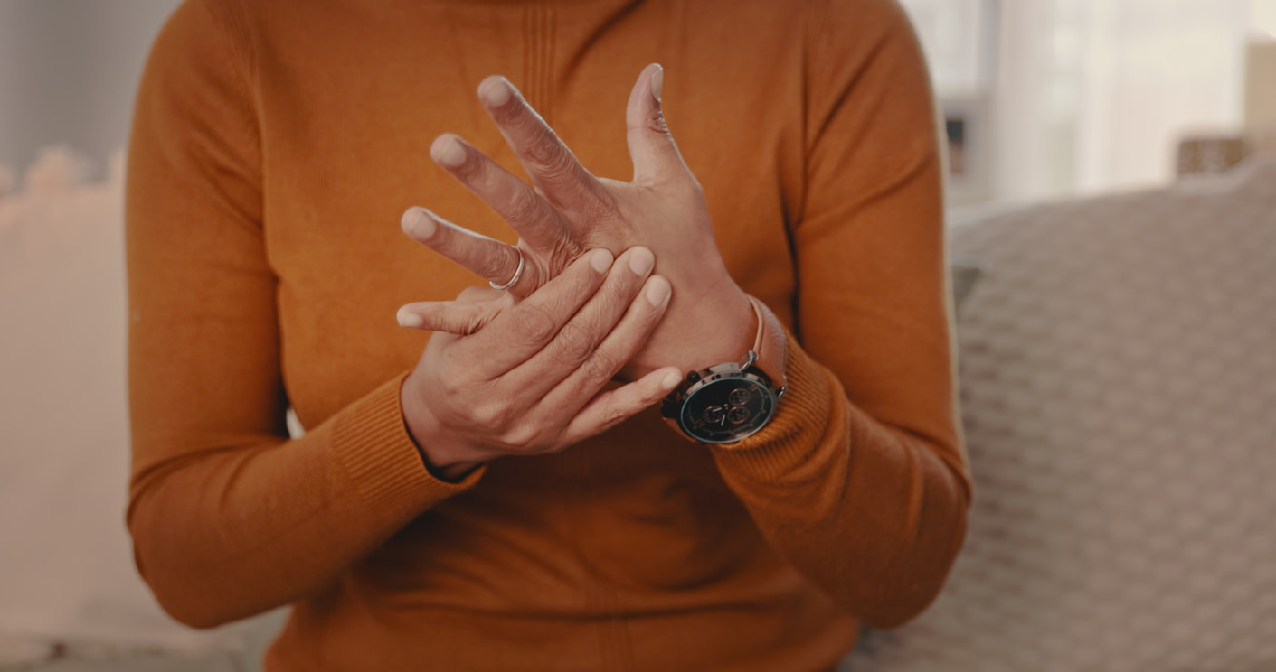 person-touching-her-hands-worried