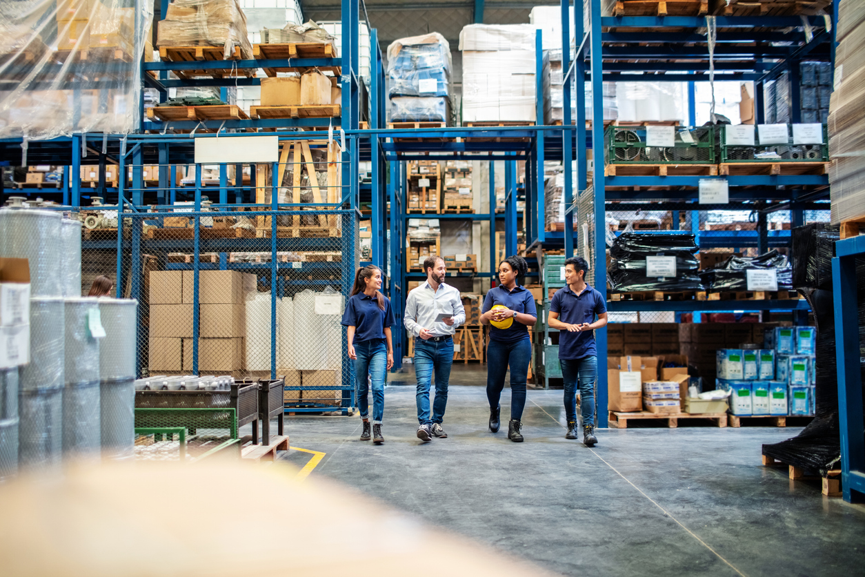 Group of employees inside the factory working together