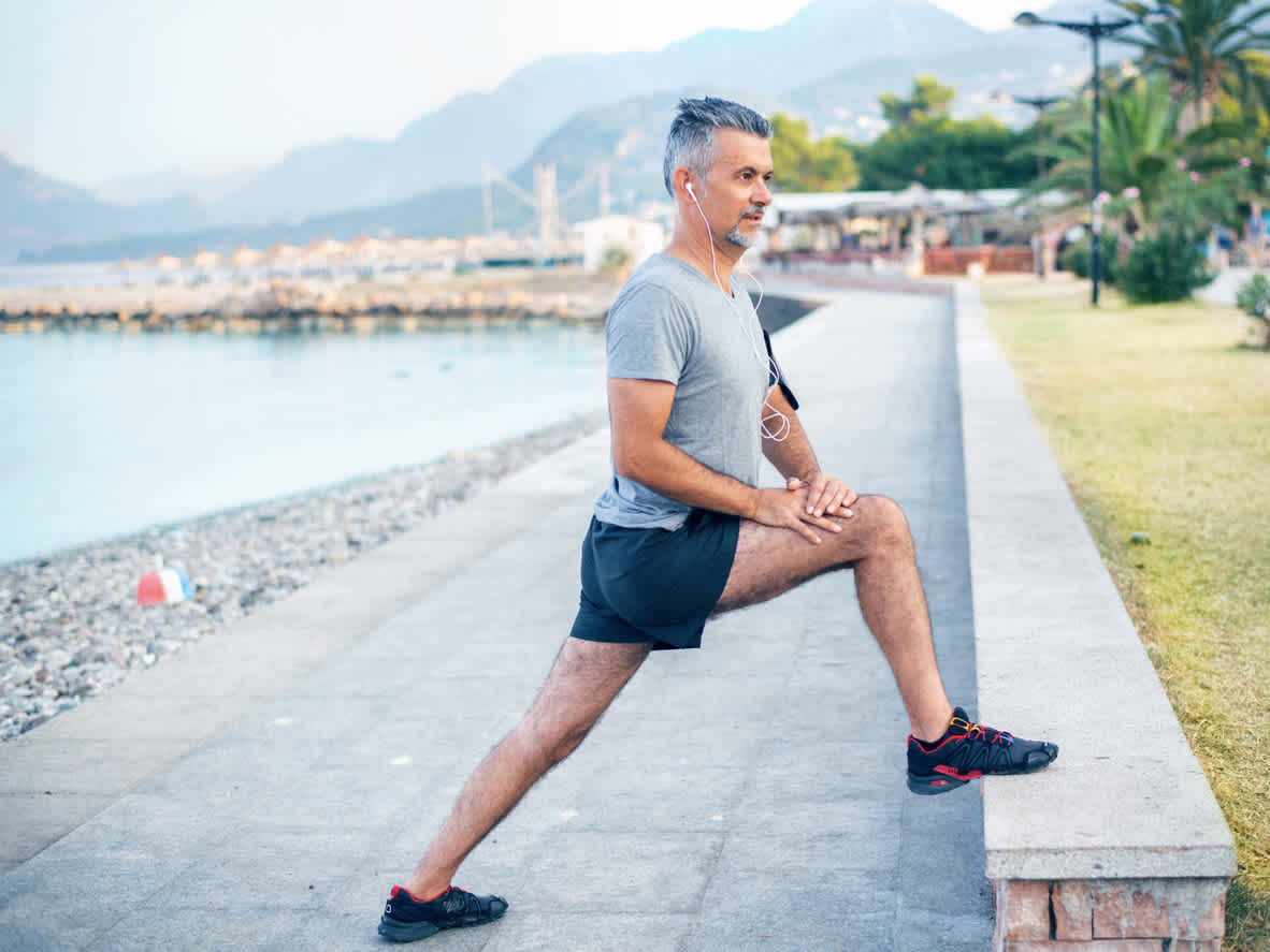 man-stretching-near-the-sea