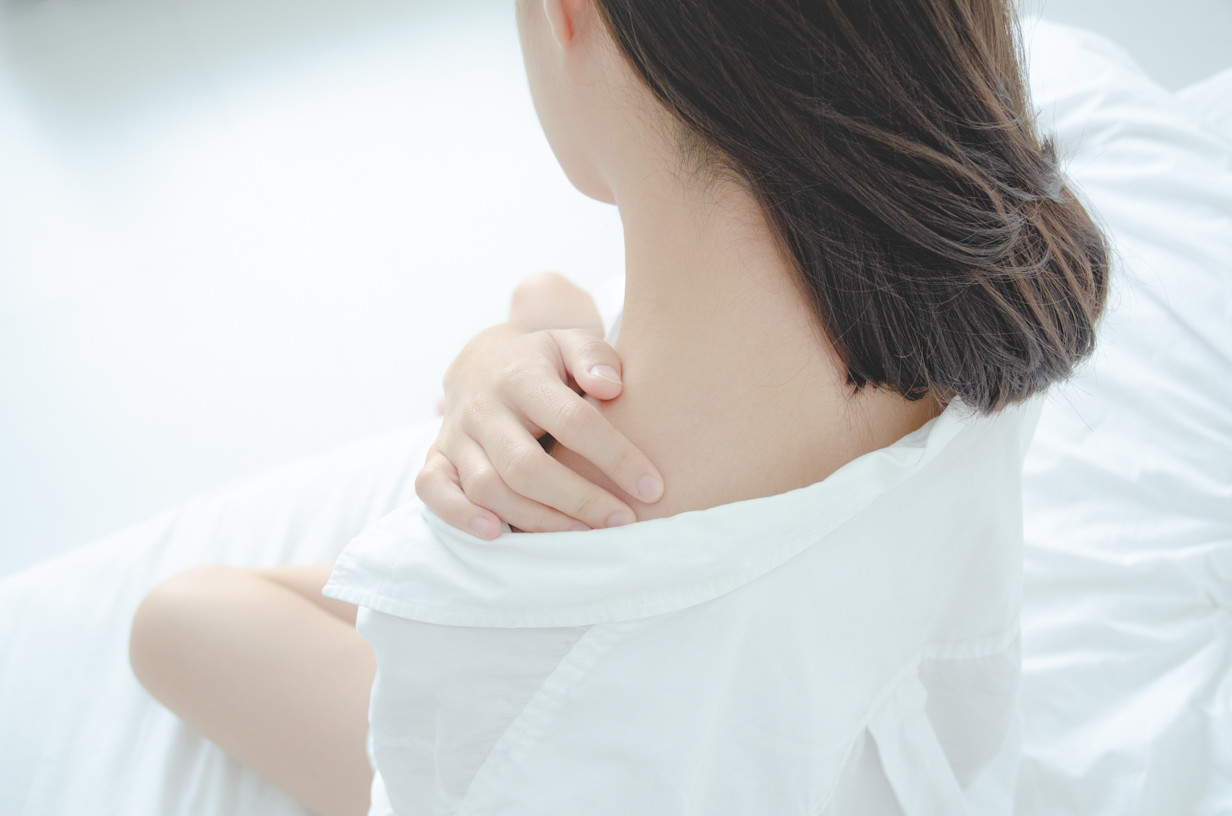 Woman rubbing her neck