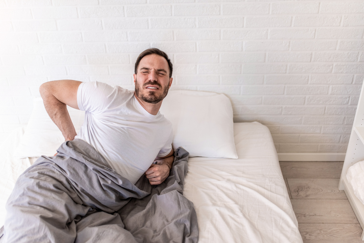 man-wondering-how-to-sleep-with-herniated-disc