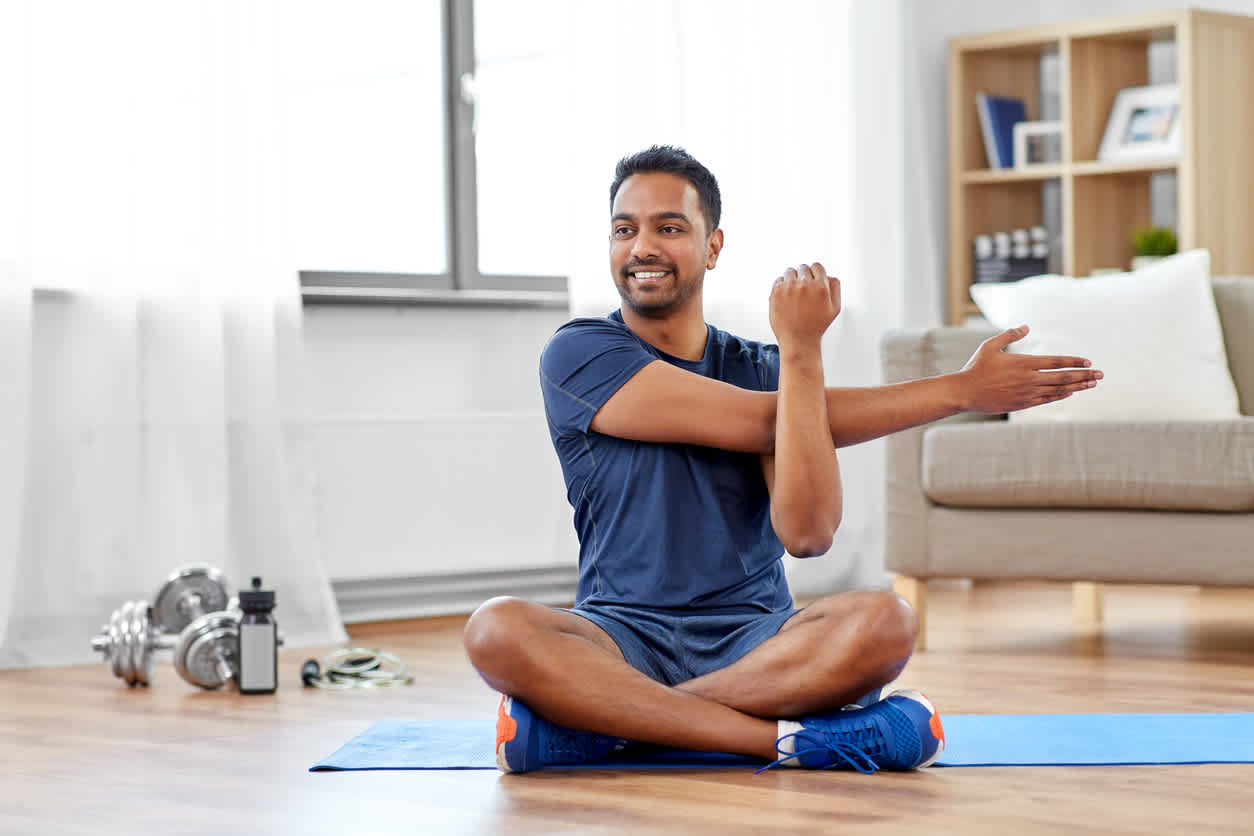 Man-stretching-before-working-out-at-home