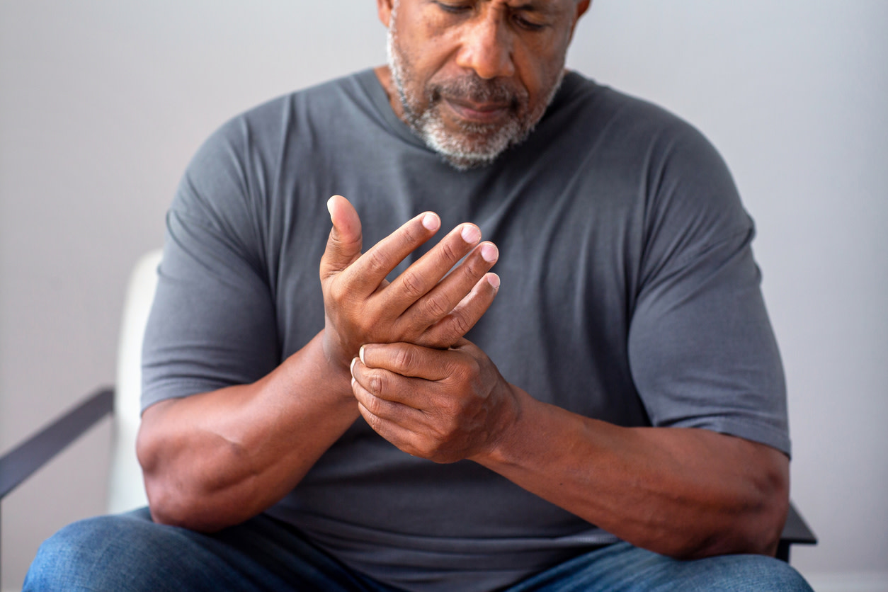 man feeling ulnar nerve entrapment