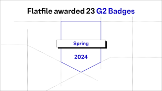 "Flatfile awarded 23 G2 Badges" on a white background with an icon representing a G2 badge