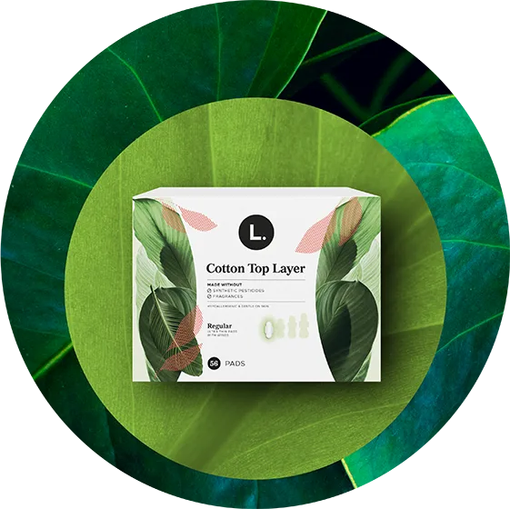 100% Pure Cotton. Organic pads packaging on a leaf-themed background