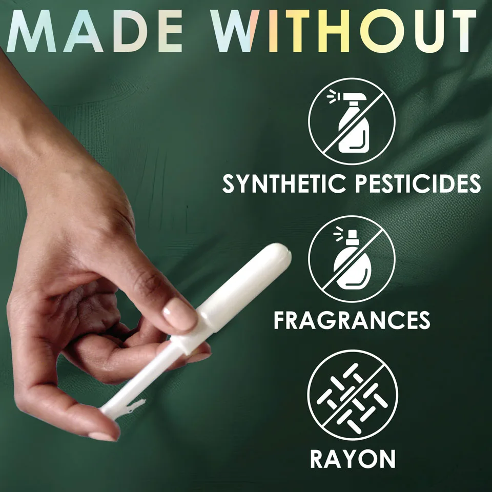 Hand holding L. tampon applicator. L. tampons are made without synthetic pesticides, fragrances, and rayon.