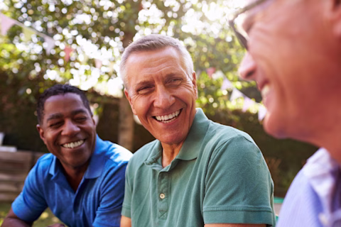 Three men laughing with each other Three men laughing with each other