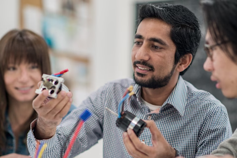 A man holding electrical parts A man holding electrical parts