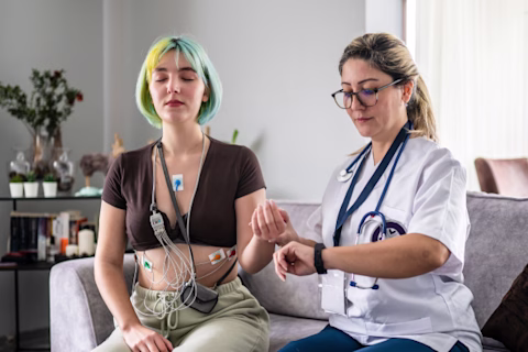 A woman being treated by a health professional