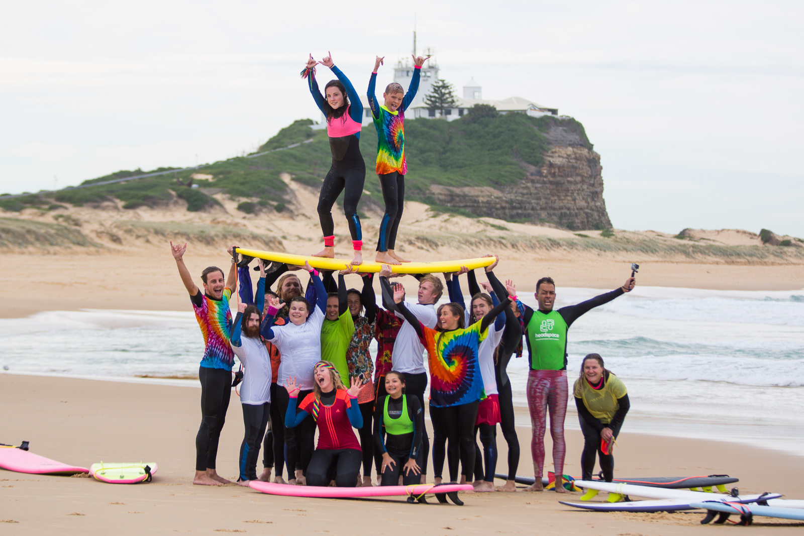 Young surfers at the beach standing on surfboards