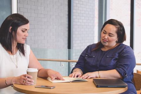 A Maori woman going through her program with her Coach A Maori woman going through her program with her Coach