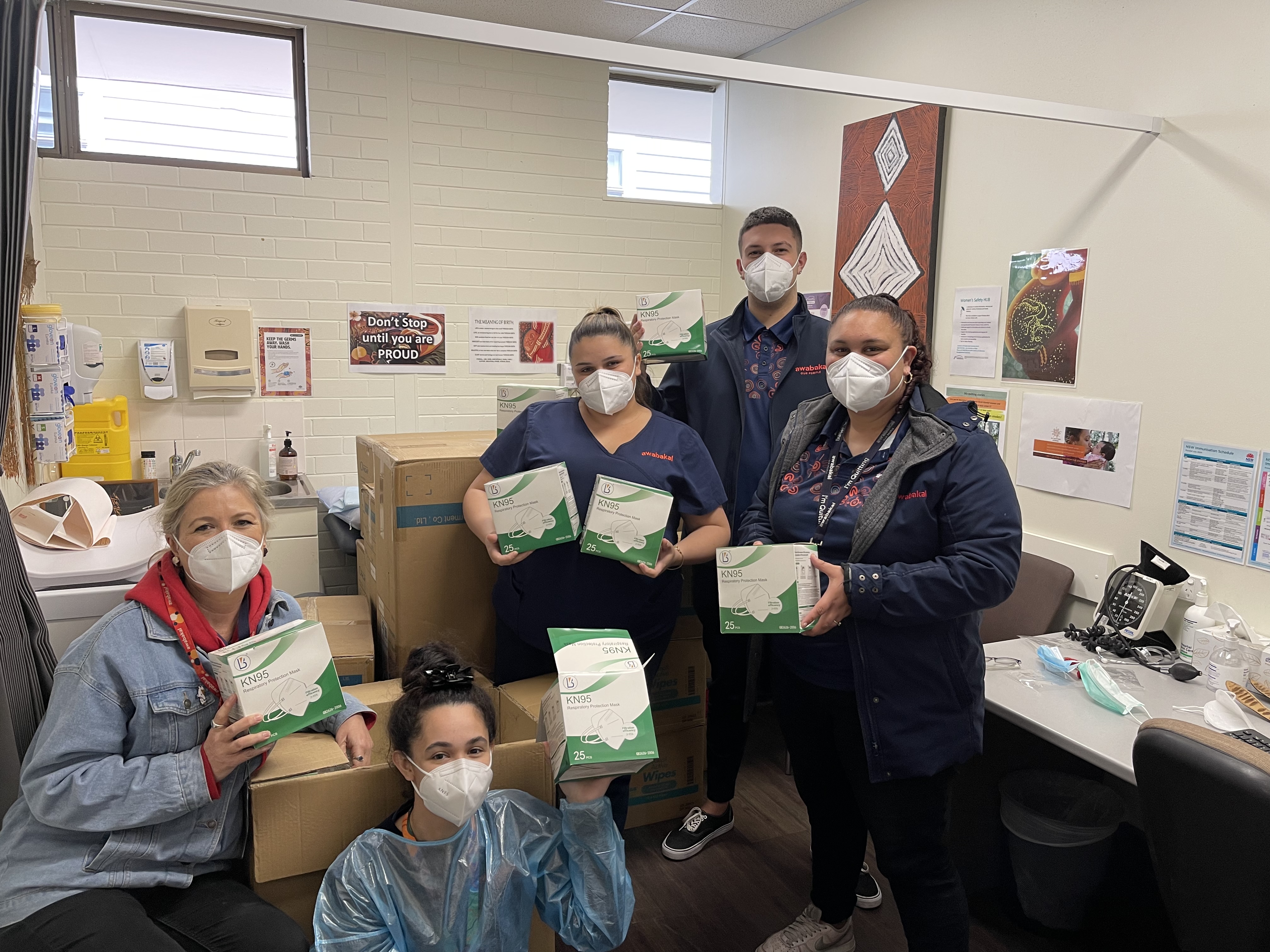 Group image of healthcare workers in masks with mask delivery 