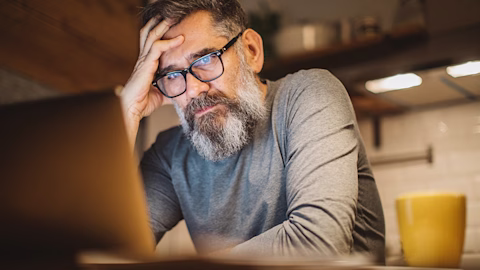 Person working at laptop with coffee. Person working at laptop with coffee.