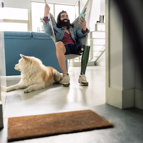 Man with an amputated leg recovering at home Man with an amputated leg recovering at home