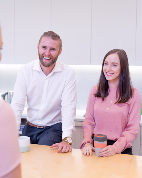 Woman and man smiling in a cafe Woman and man smiling in a cafe