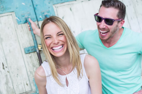 A happy couple grinning with big smiles A happy couple grinning with big smiles