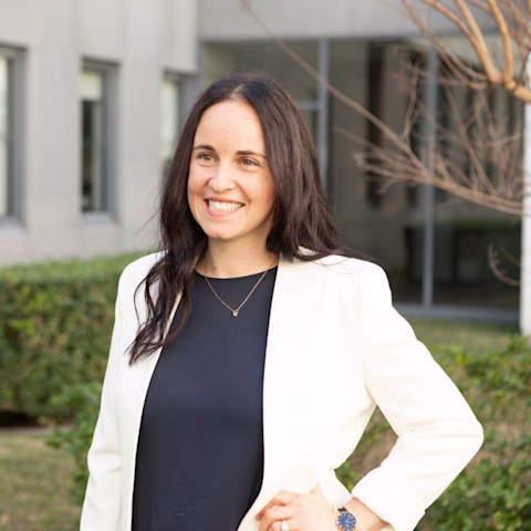 Dr Aliza Werner-Seidler smiling at the camera while wearing a white blazer Dr Aliza Werner-Seidler smiling at the camera while wearing a white blazer
