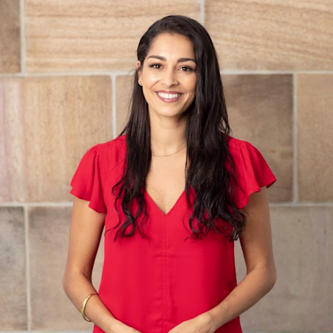 Dr Gina Cleo wearing a red top Dr Gina Cleo wearing a red top