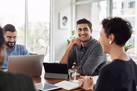 A group of office workers at a table A group of office workers at a table