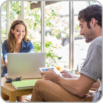 Image of a couple reviewing health documents in their living room