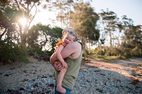 Woman pointing at kangaroos near a cliff Woman pointing at kangaroos near a cliff