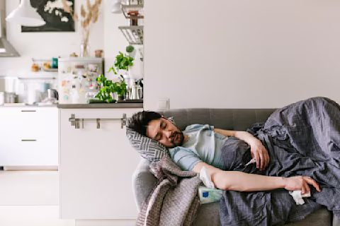 Person sleeping on the couch. Person sleeping on the couch.