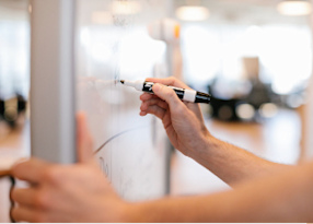 Man drawing on whiteboard