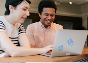A Flatiron School teaches a student how to code