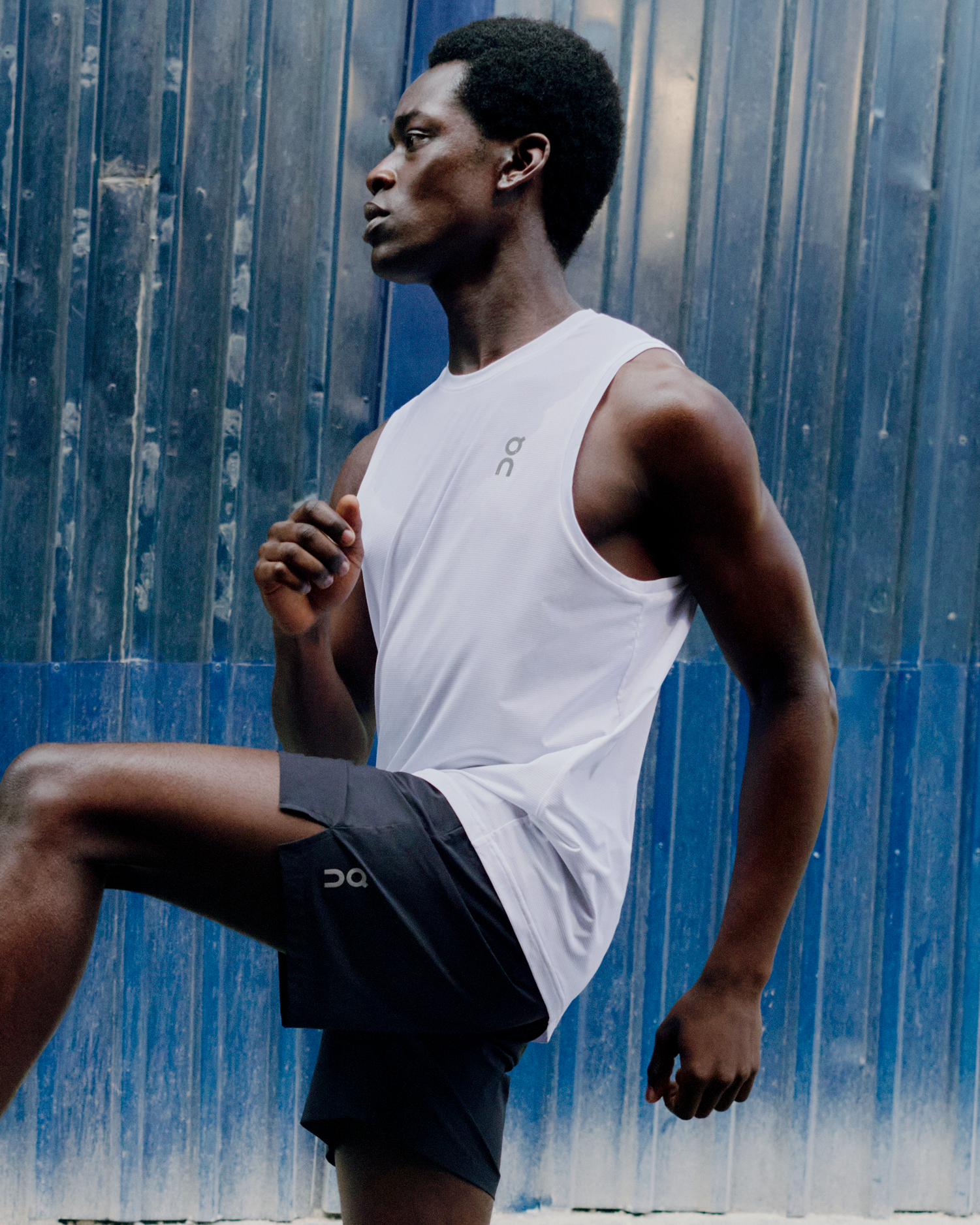 A male athlete warming up while wearing On performance gear.