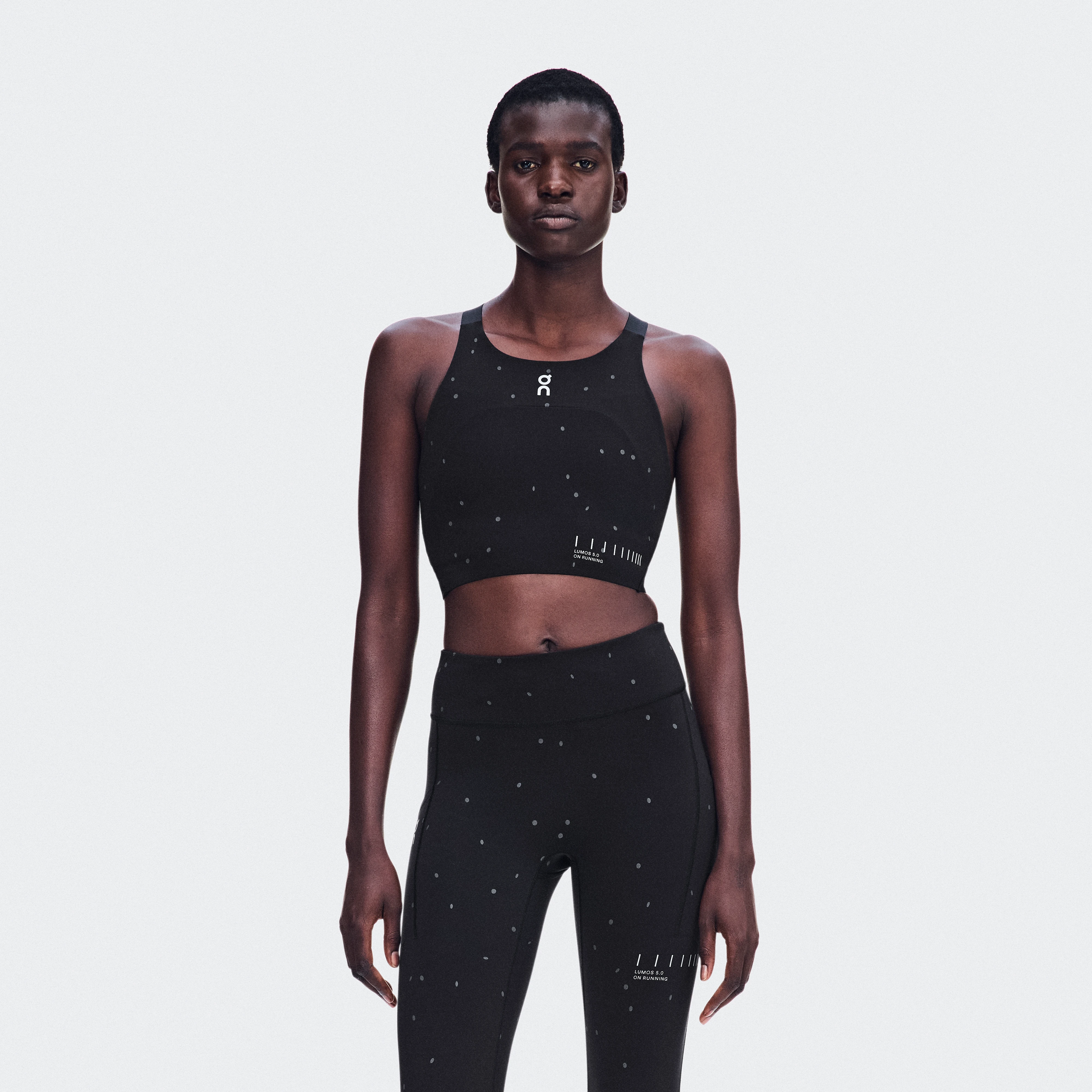 On Performance Crop Lumos Black & Eclipse Women – Reflective elements, anytime performance running Tops and t-shirts