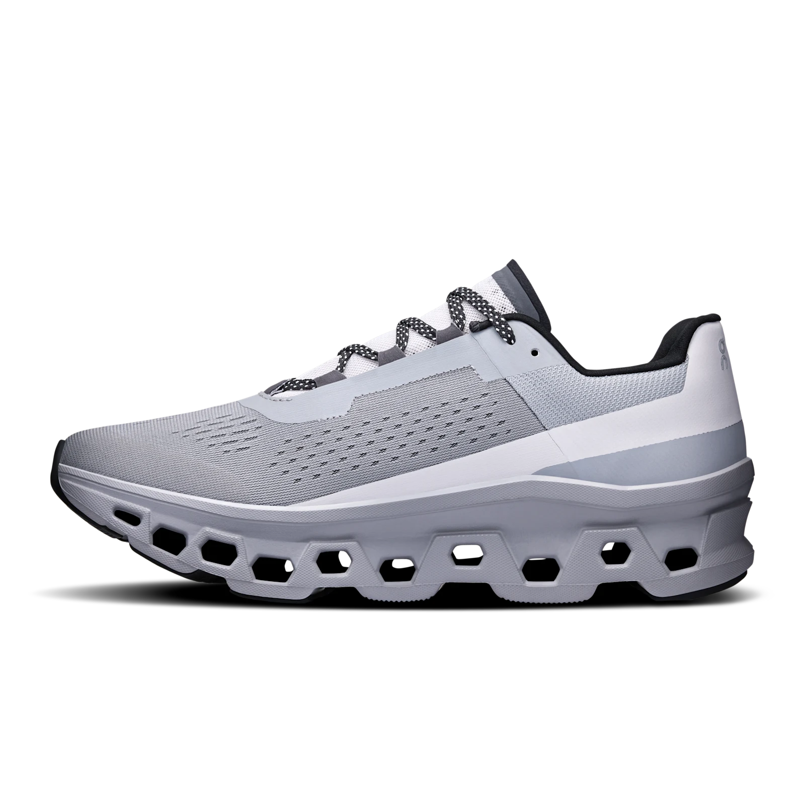 Side profile of On Cloudmonster running shoe showing the CloudTec pods
