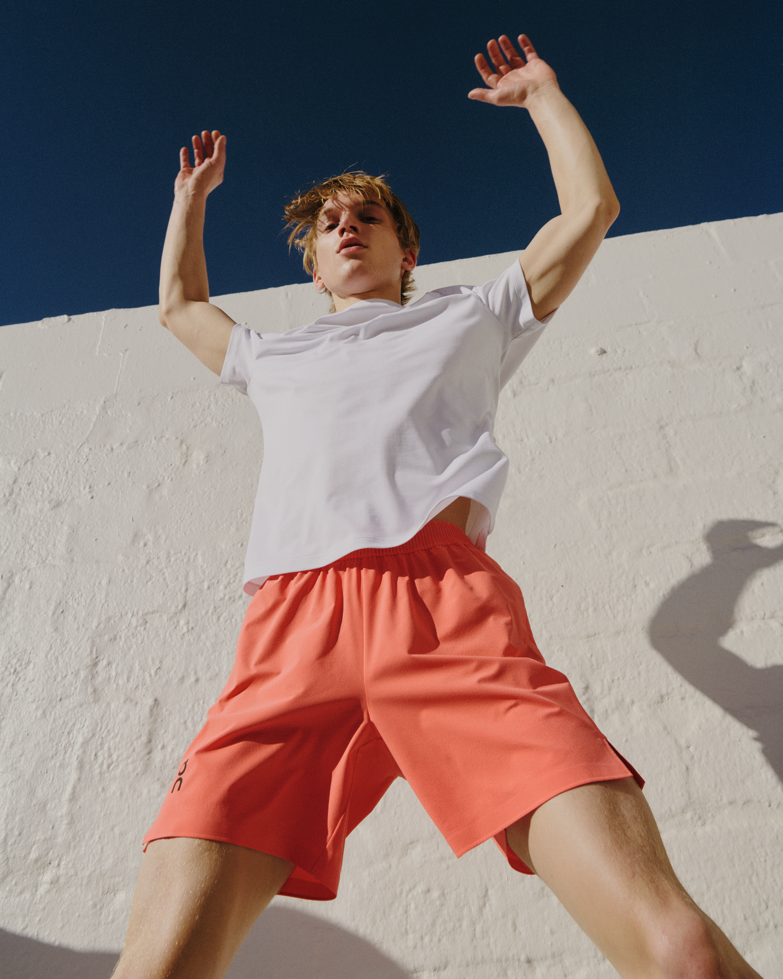 Man doing jumping jacks.