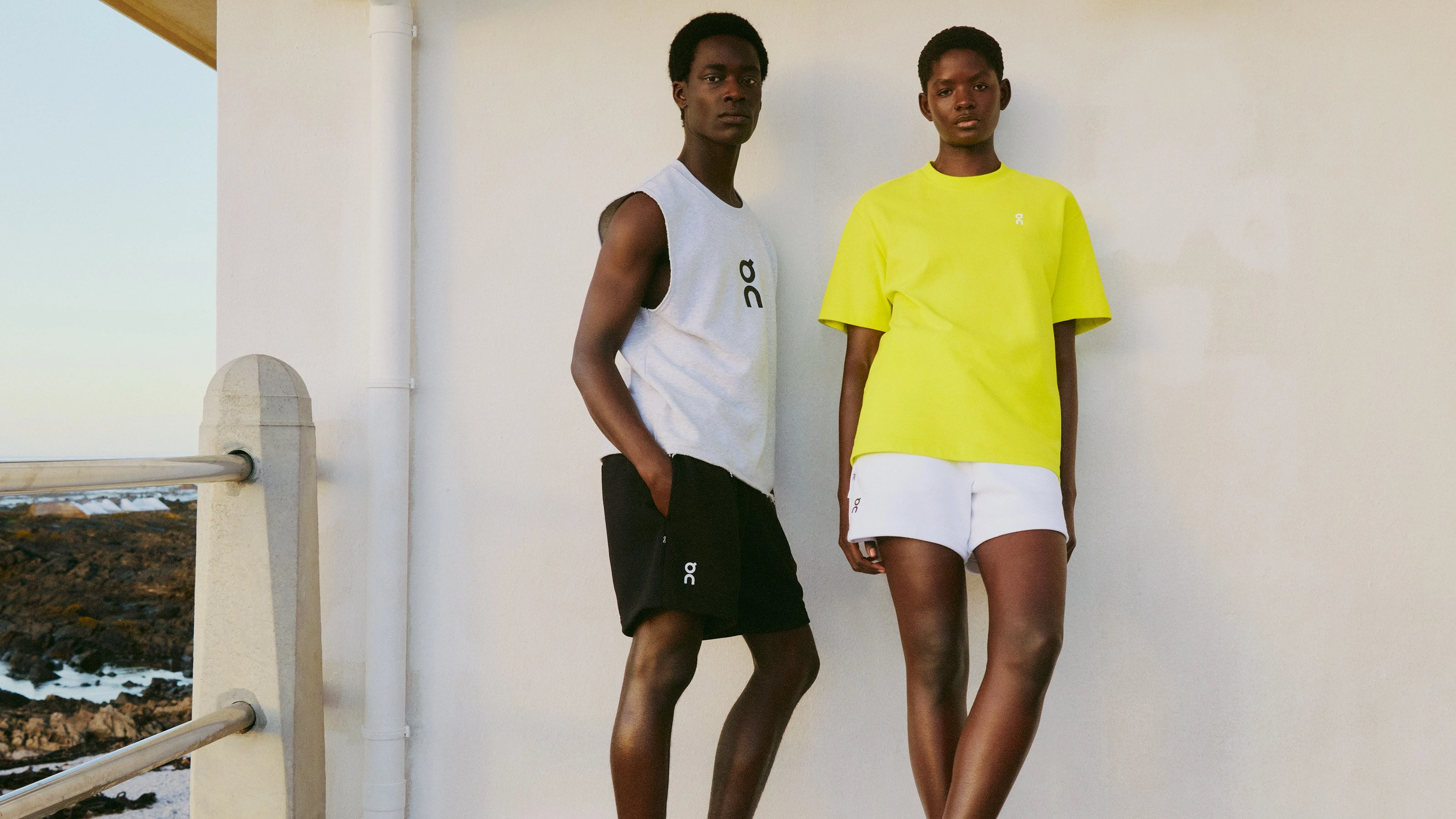A male and female athlete wearing On shorts, showcasing fit and length for a guide on how to measure inseam on shorts.