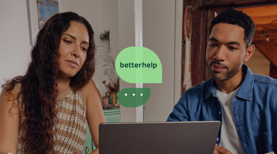Woman and man in virtual couples therapy session on a laptop.
