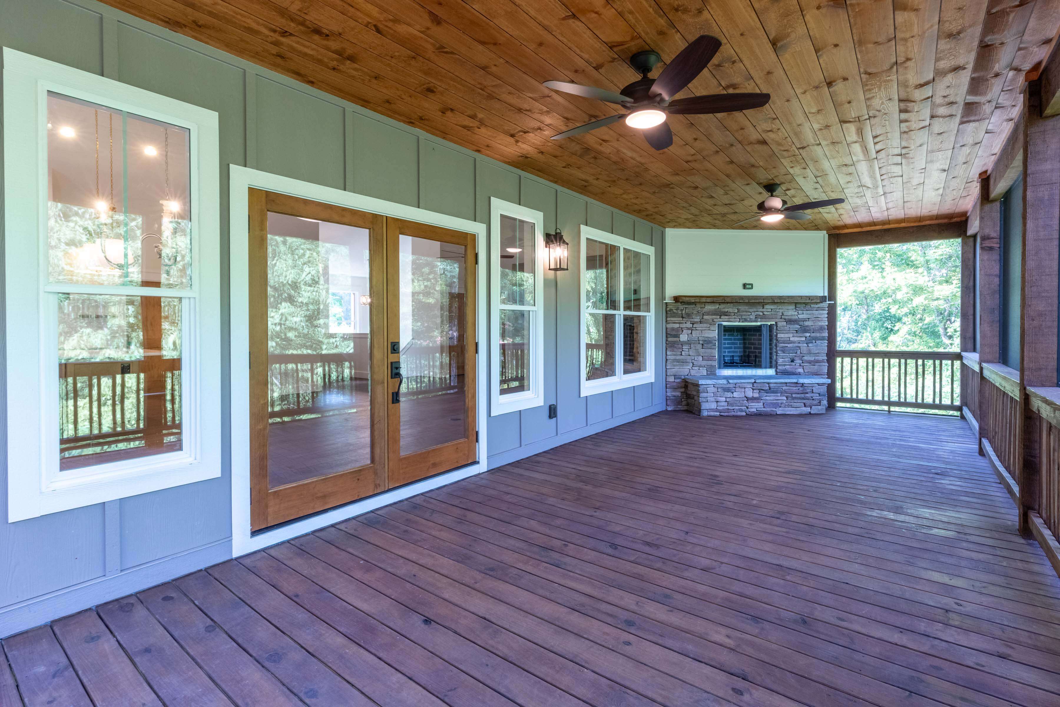 Sundrops home outdoor porch with fireplace.