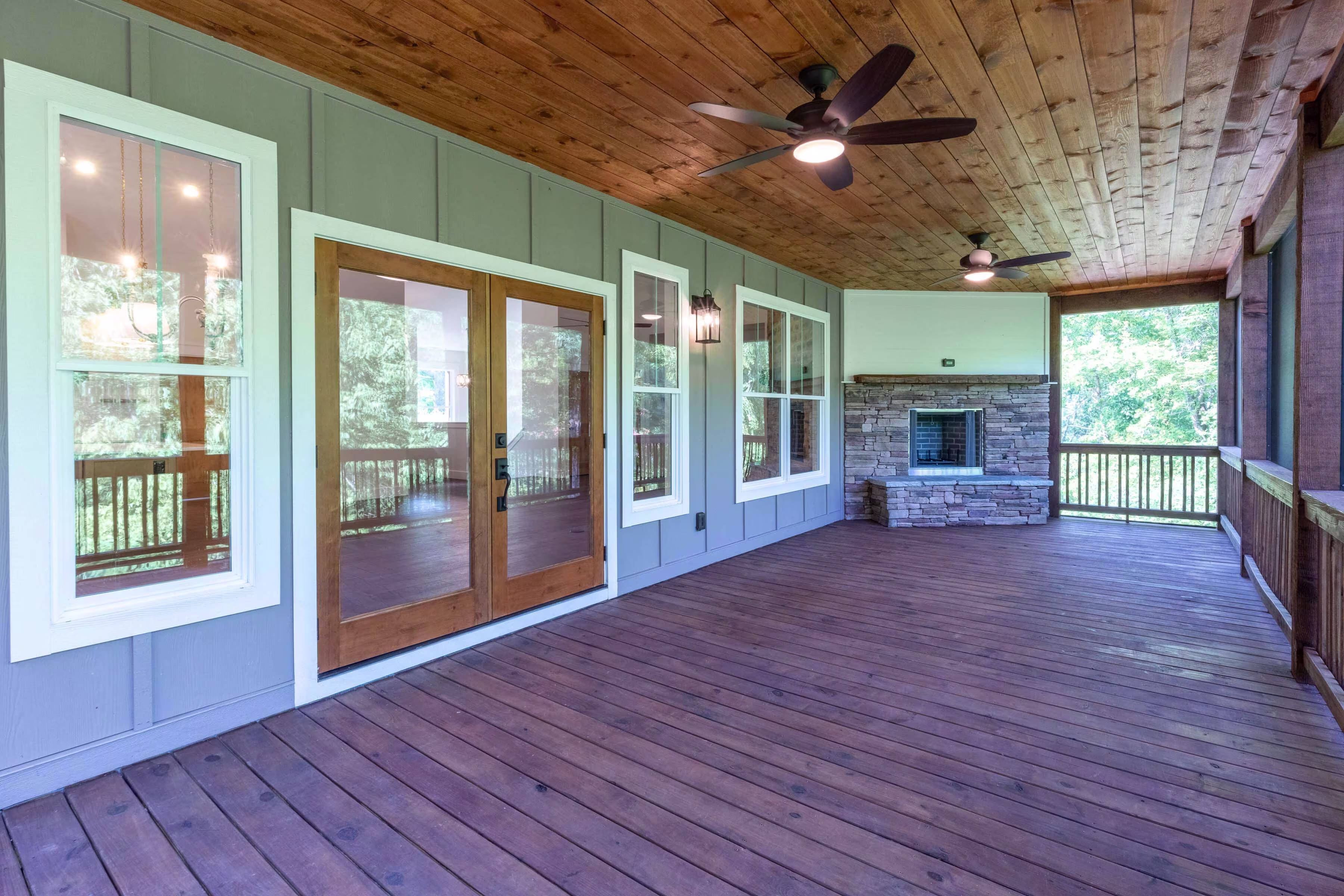 Sundrops home outdoor porch with fireplace.