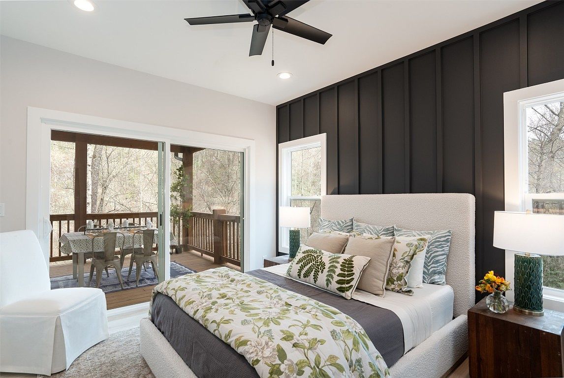 The master bedroom in the Aaronson home in Cashiers on Lake Glenville.