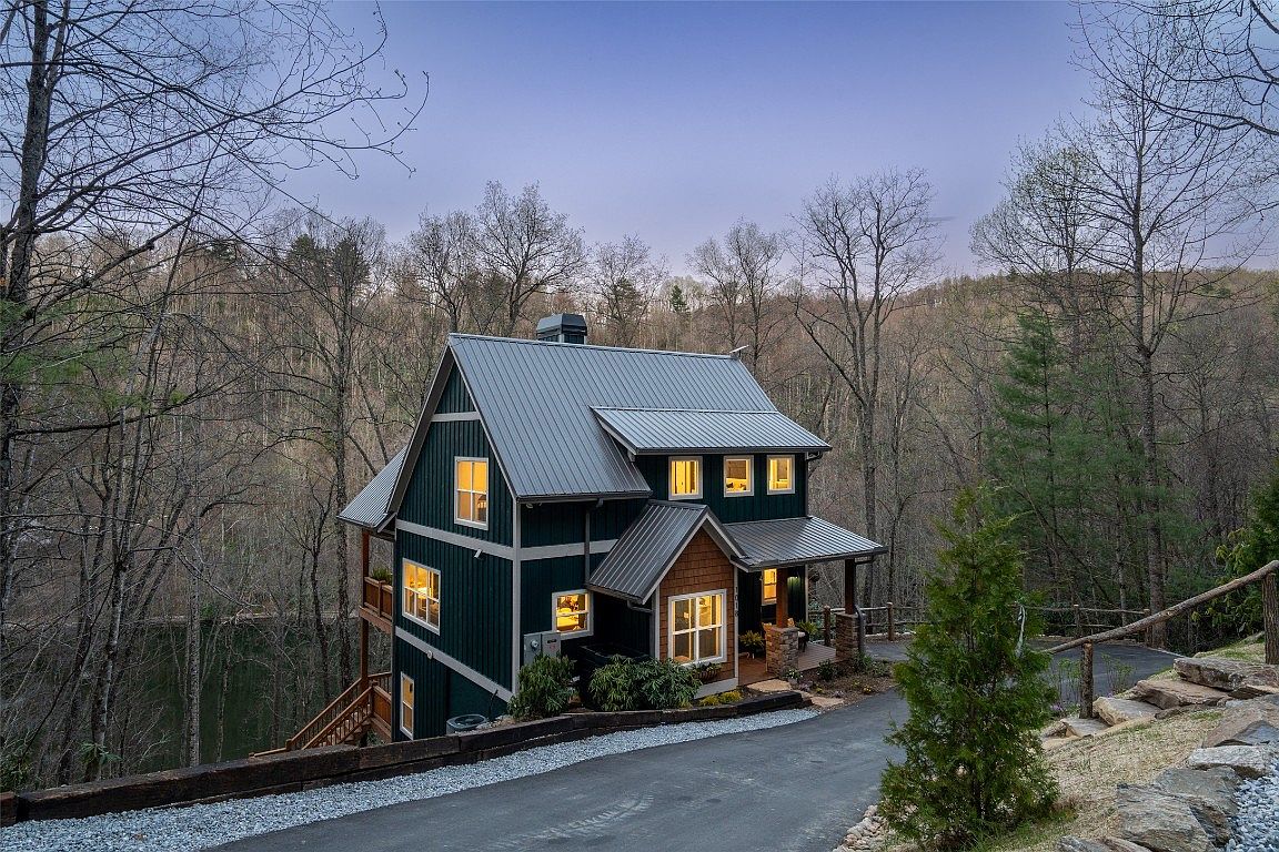 The side view at night of the Aaronson home in Cashiers on Lake Glenville.