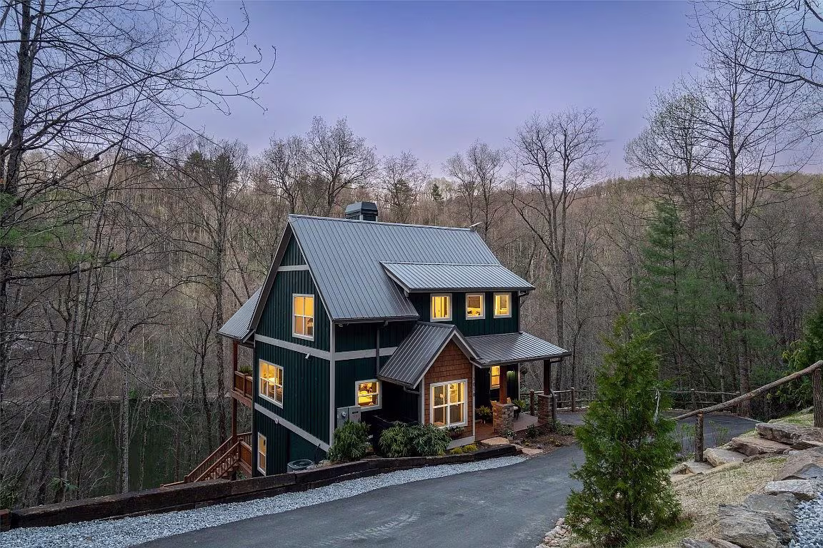 The side view at night of the Aaronson home in Cashiers on Lake Glenville.