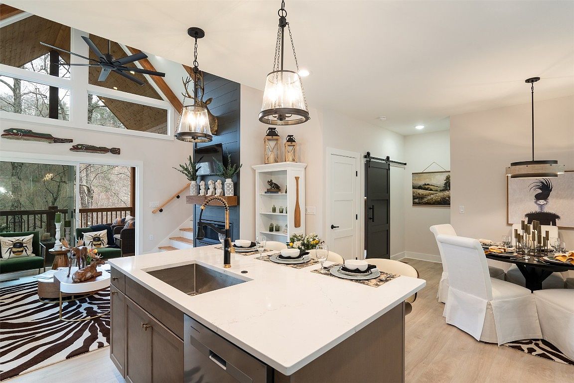 The kitchen and dining room of the Aaronson home in Cashiers on Lake Glenville.