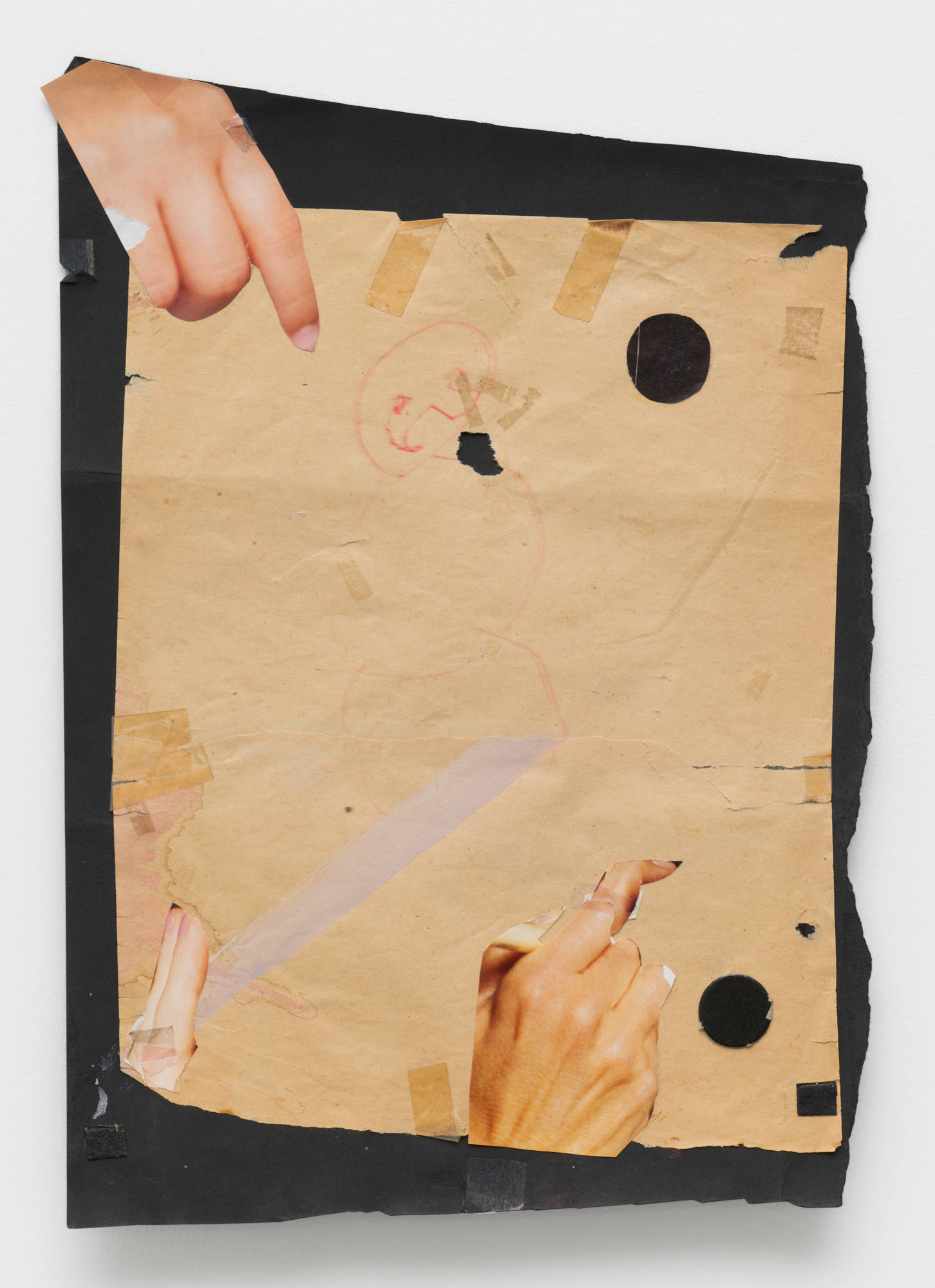 A tattered sheet of brown construction paper with two circles cut from it is mounted to a misshapen sheet of black paper. Two hands, cut from magazine photos, are mounted to the top and bottom of the artwork.
