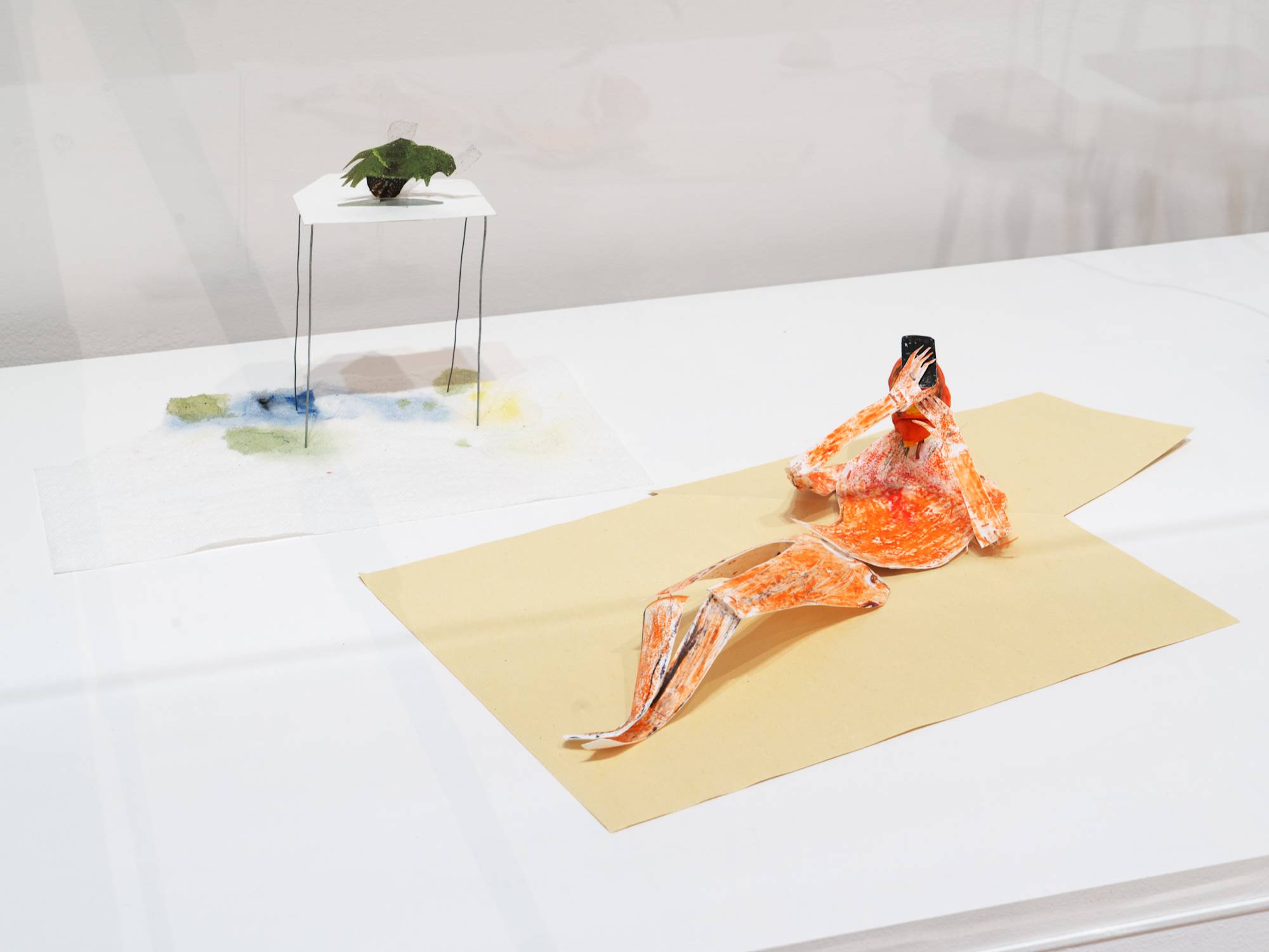 Oblivion Seeker, 2025, Tempera, ink, acrylic, watercolor, crayon, graphite, felt tip marker, and tape on modeling compound, high-density polyethylene, string, wire, paper, inkjet print, and paper towel
22 × 22 × 6 ½ in. (55.88 × 55.88 × 16.51 cm) Dimensions variable