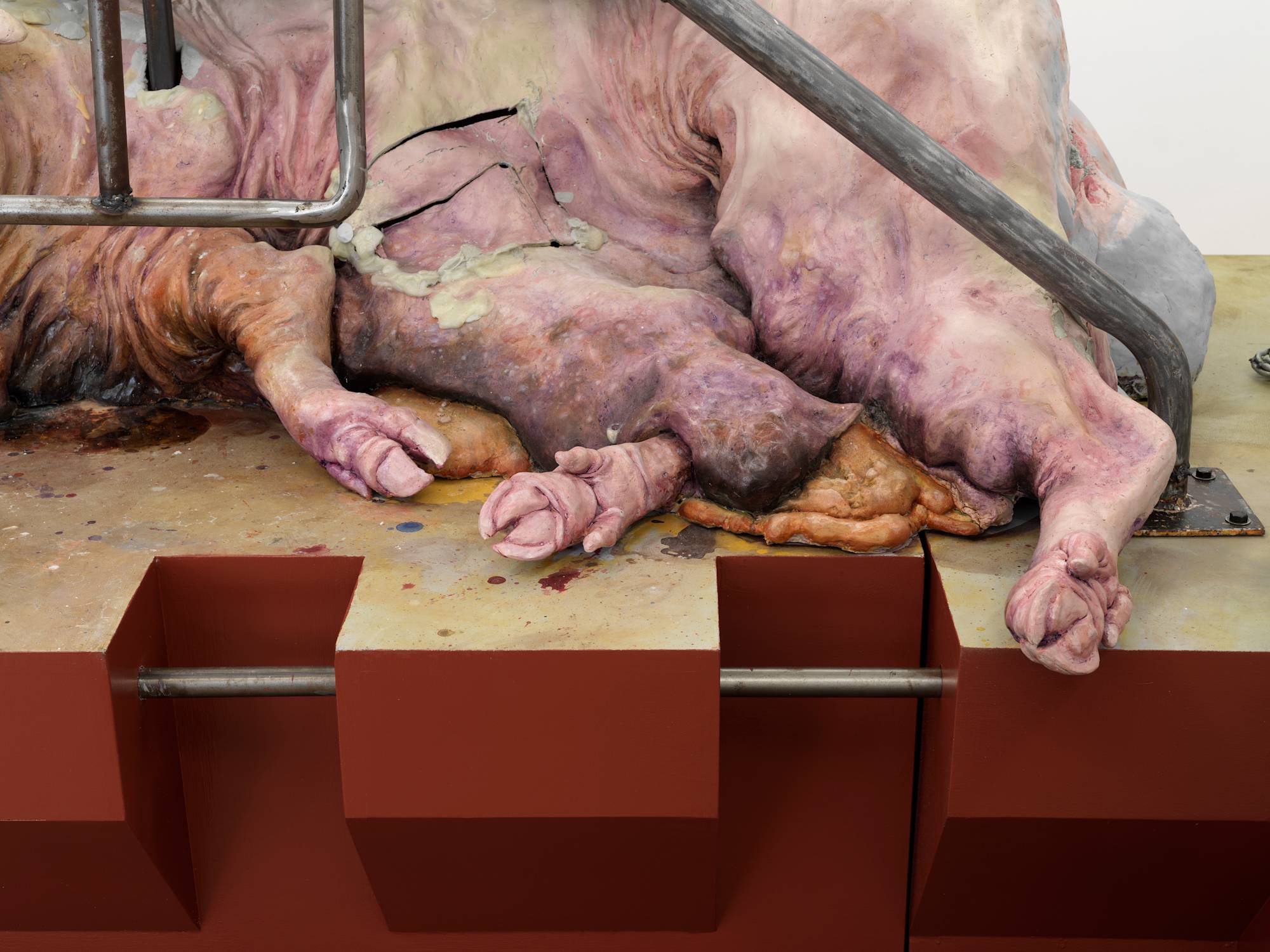 Close up view of a large and abstract sculpture depicting the bottom of a pig.