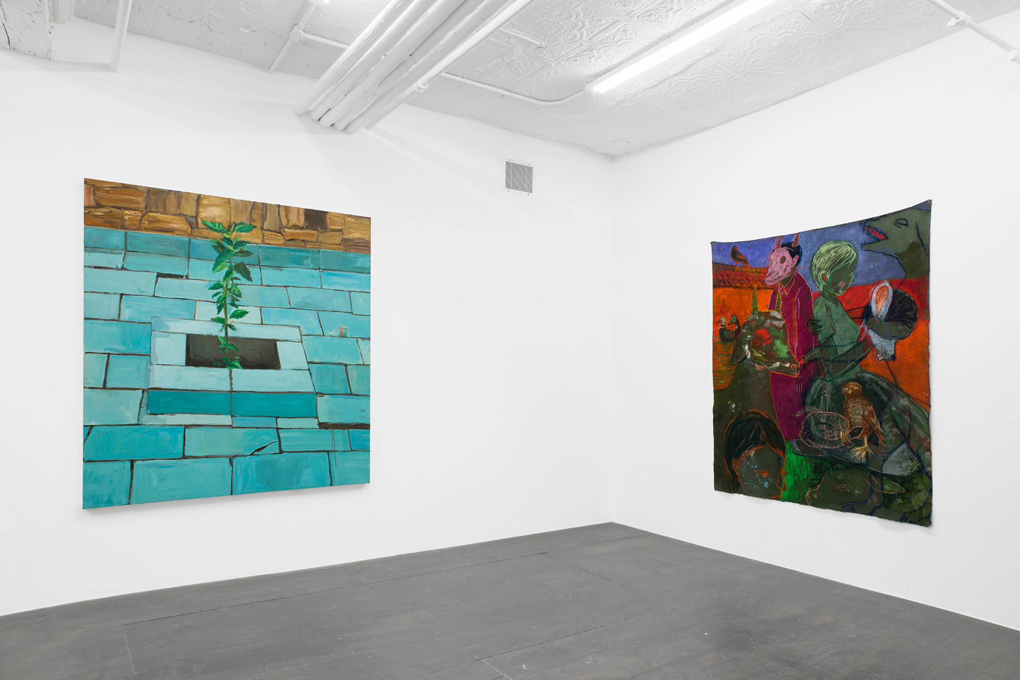 In the South West corner, in the basement of the gallery, a stretched painting of a plant and an unstretched painting of abstract figures hang on opposing walls.